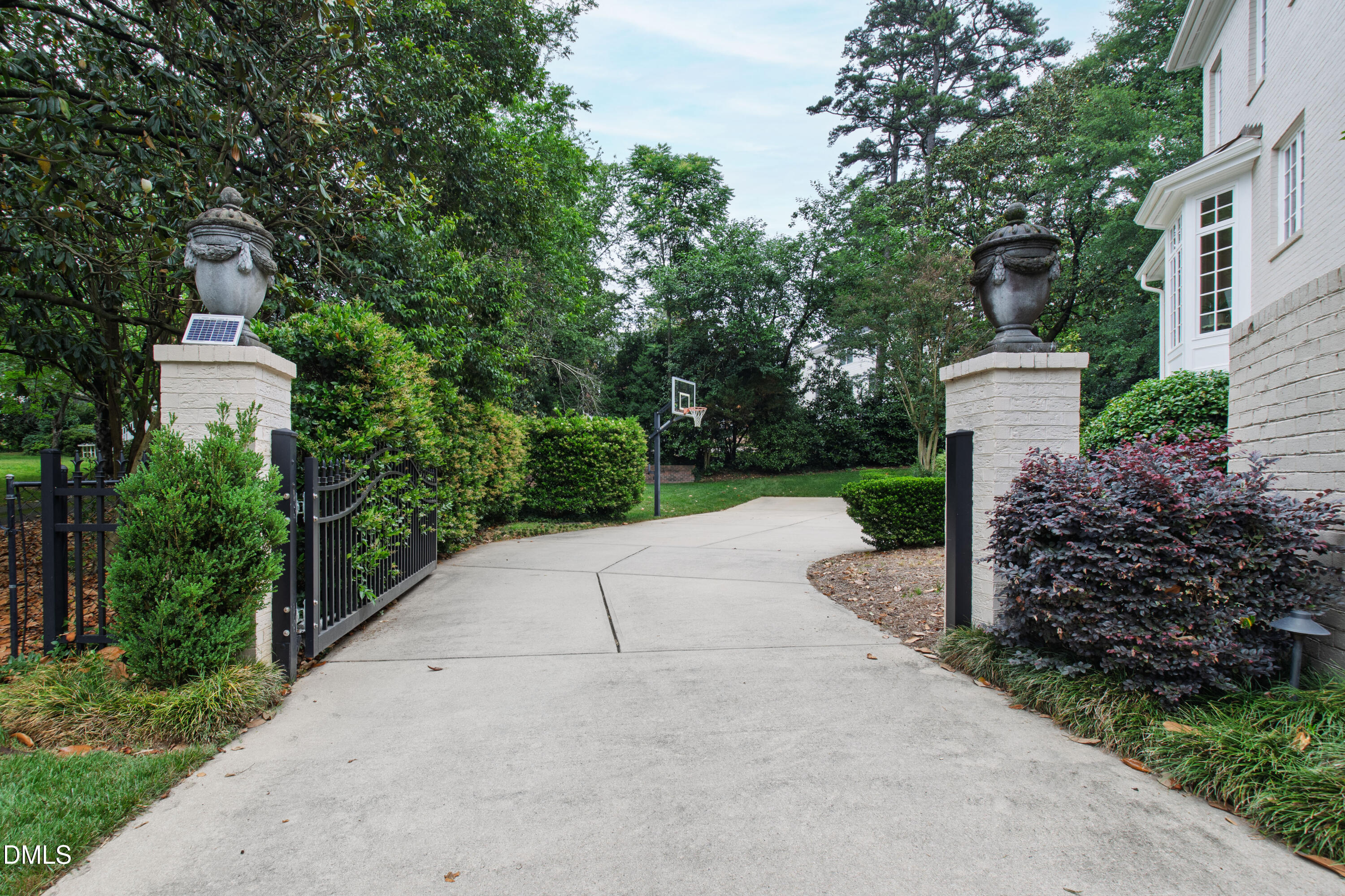 2536 Wake Drive Raleigh, NC 27608 - Photo 66 of 74 a front view of a house with a yard and fountain