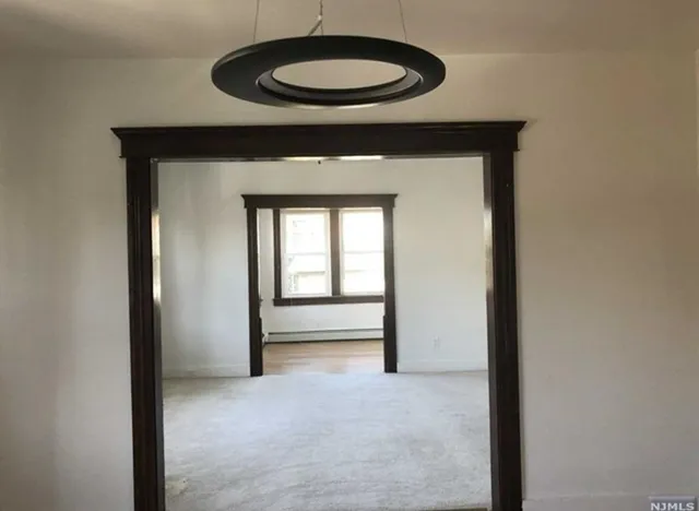 a view of livingroom with a table and a chair