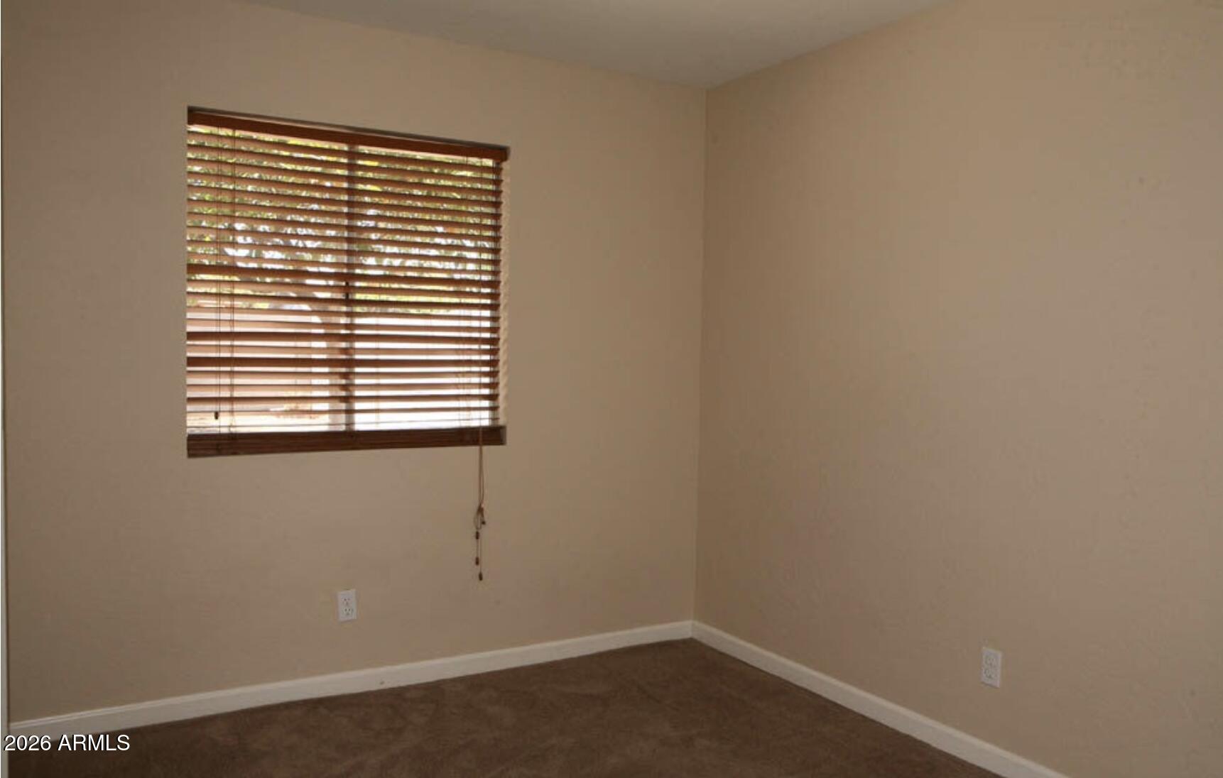 911 West Colgate Drive Tempe, AZ 85283 - Photo 8 of 15 an empty room with a window