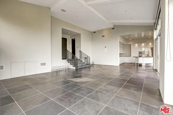 a kitchen with kitchen island granite countertop a sink and counter space