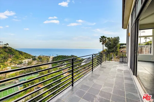 a kitchen with stainless steel appliances granite countertop a refrigerator a sink and a stove