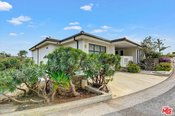 front view of a house with a street