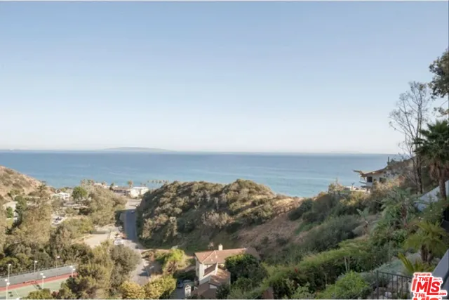 a view of the terrace with lawn chairs