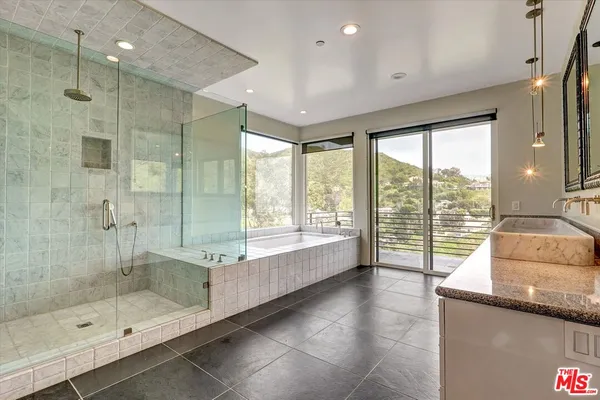 a white toilet sitting next to a shower
