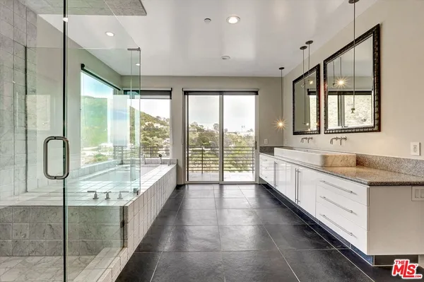 a view of walk in closet and bedroom