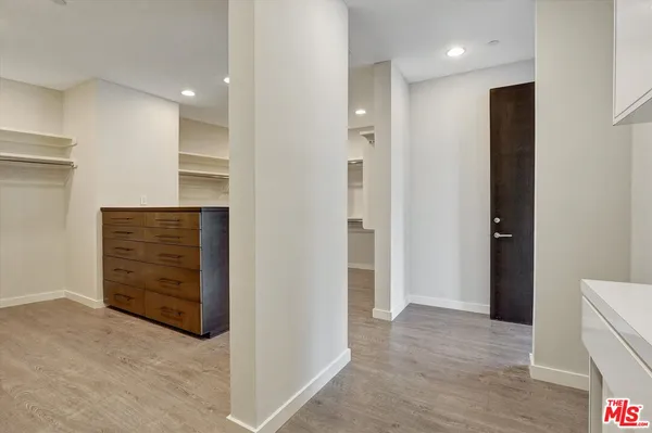 a view of an empty room with empty shelves