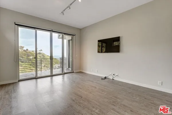 a view of a balcony with an outdoor space