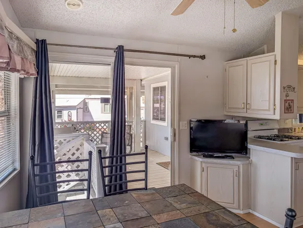 a view of a livingroom with furniture and a flat screen tv