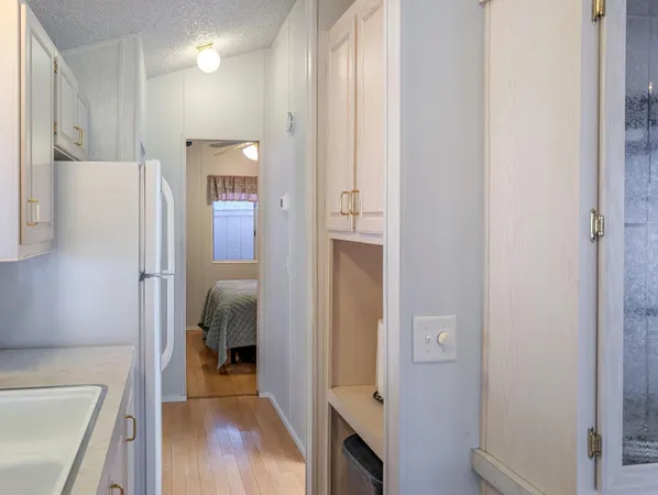 a bathroom with a tub and a hallway