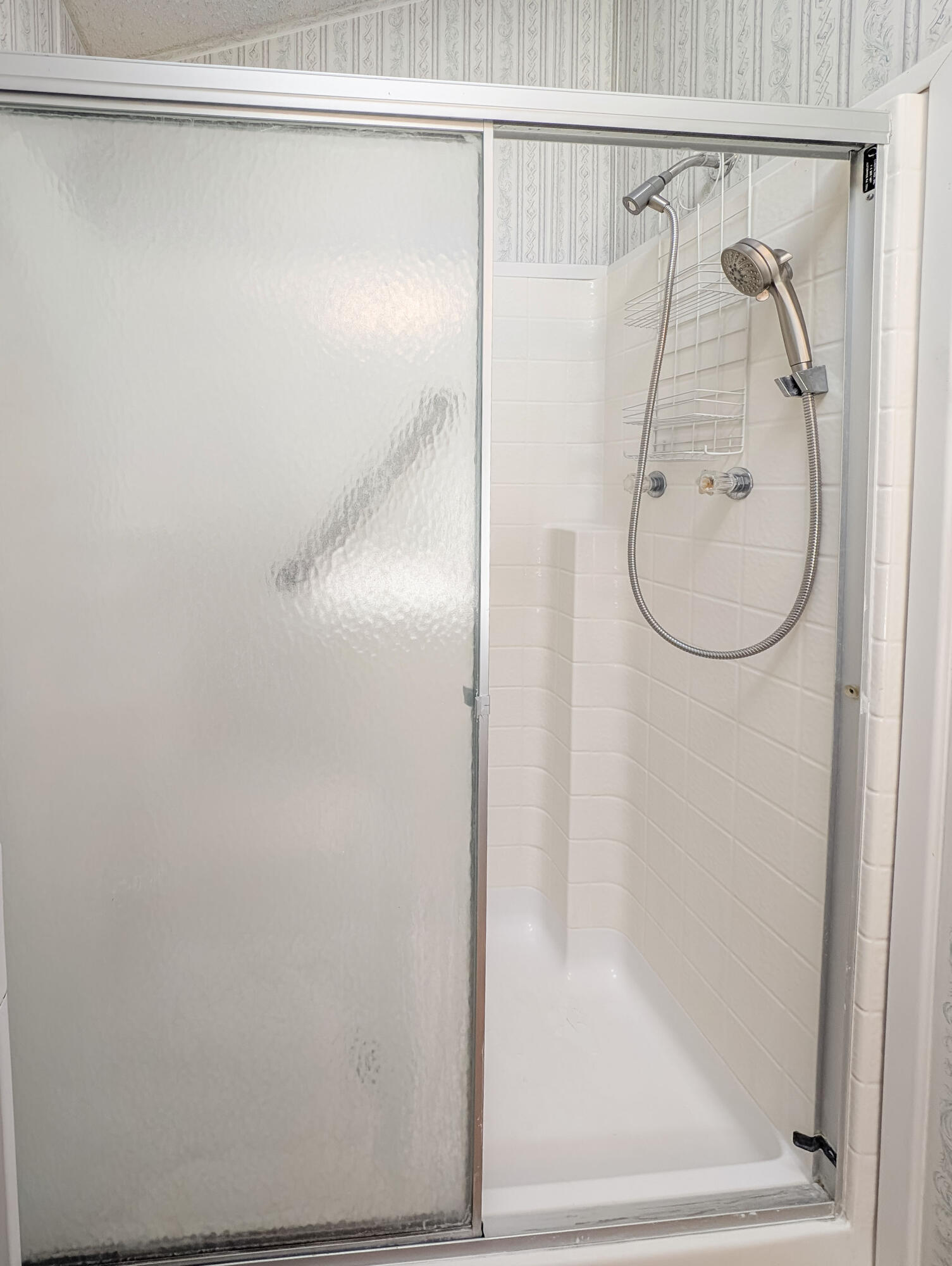 70200 Dillon Road, Unit 517 Desert Hot Springs, CA 92241 - Photo 18 of 32 a bathroom with a glass shower door
