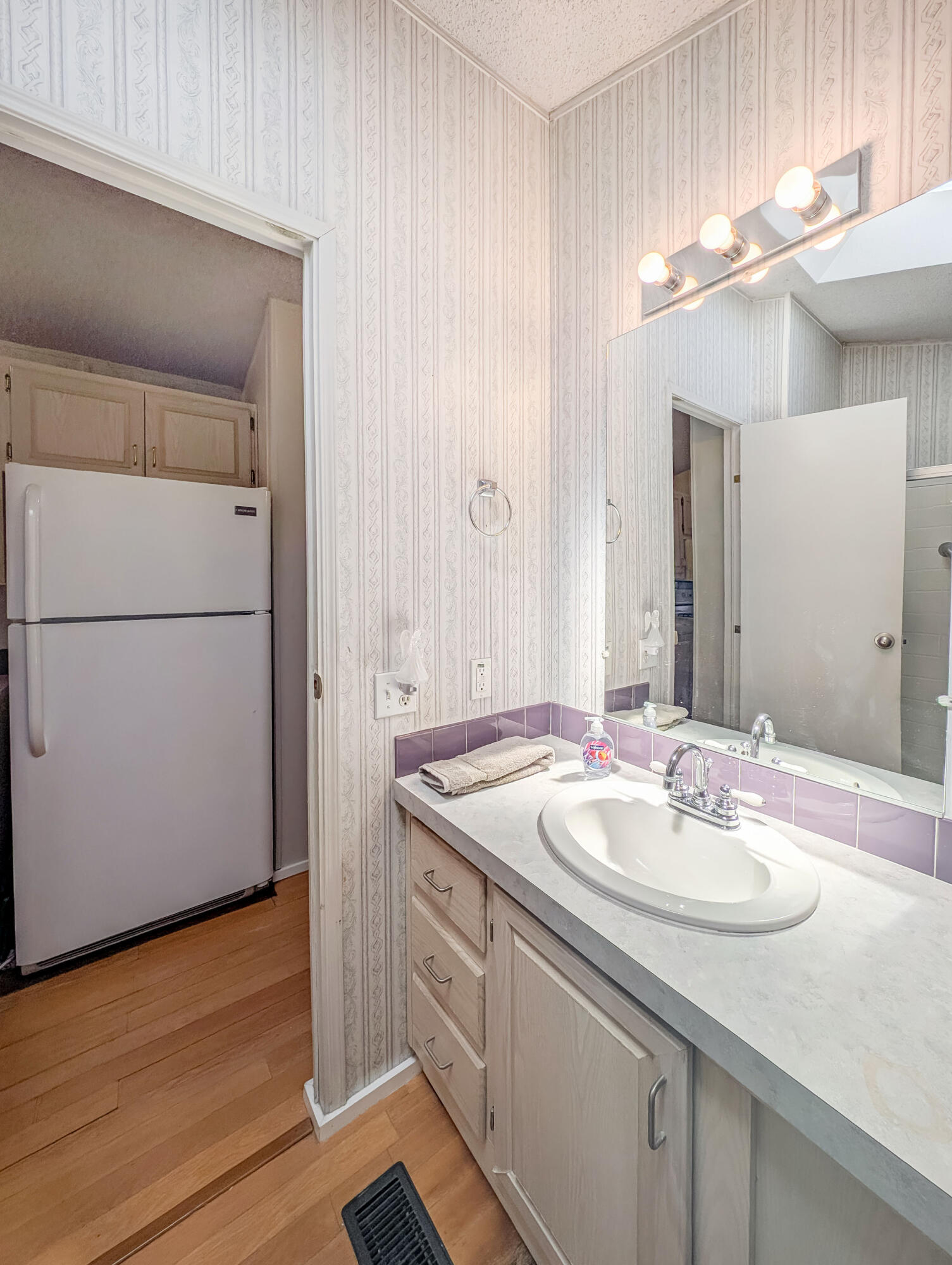 70200 Dillon Road, Unit 517 Desert Hot Springs, CA 92241 - Photo 20 of 32 a bathroom with a sink and a mirror
