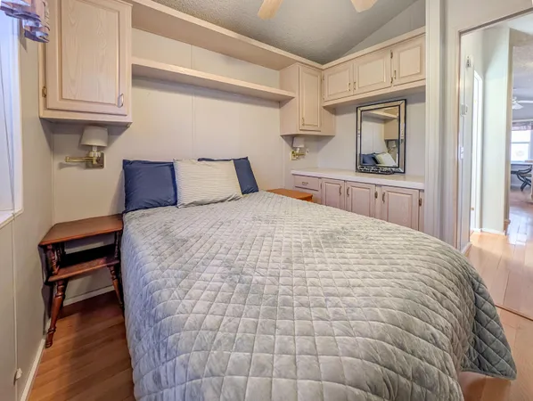 a large white bed in a white room