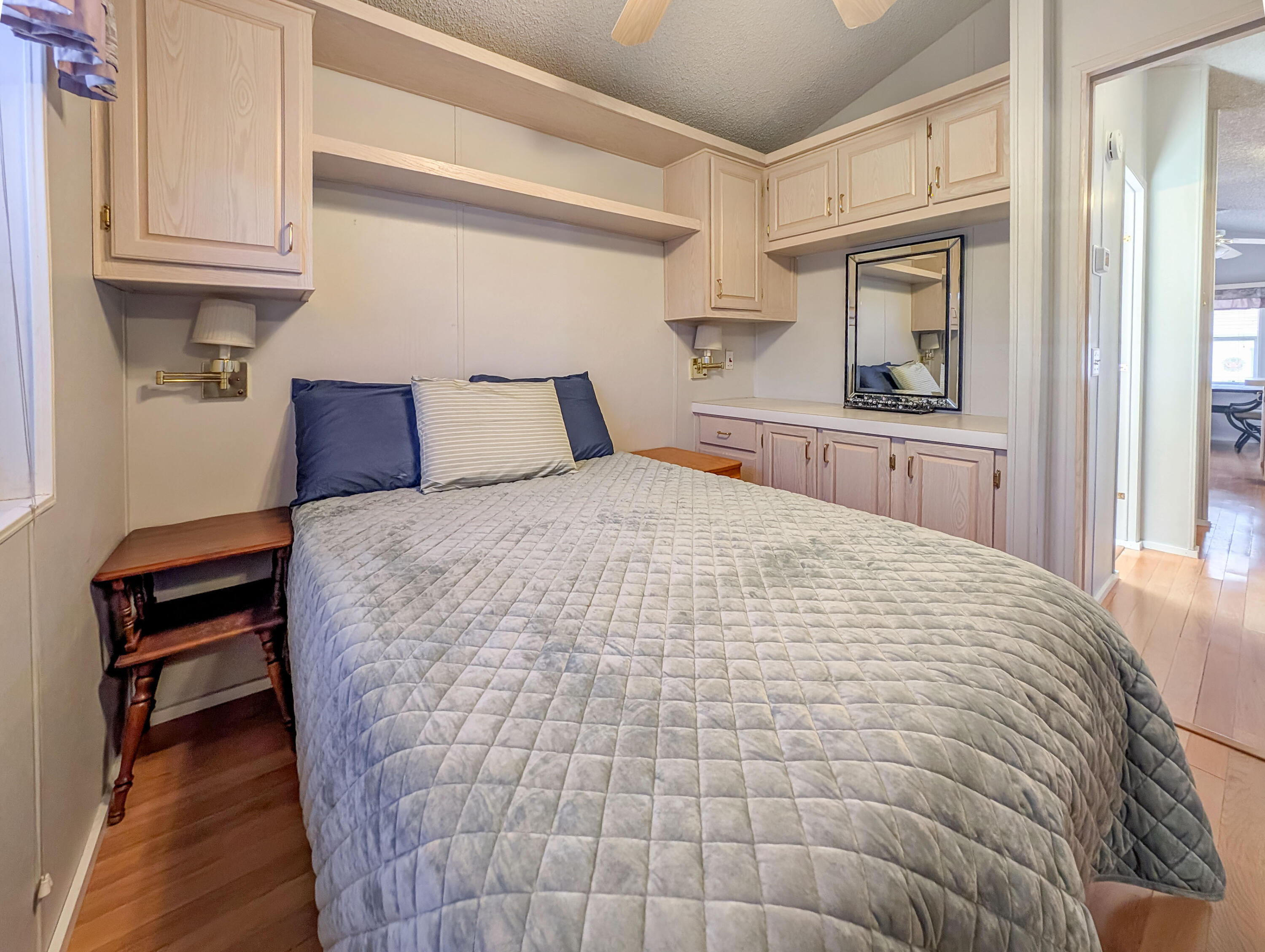 70200 Dillon Road, Unit 517 Desert Hot Springs, CA 92241 - Photo 22 of 32 a large white bed in a white room