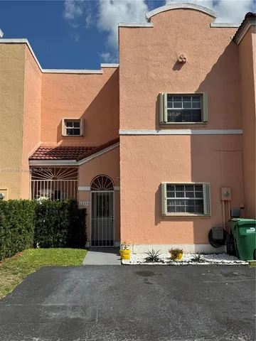a brick building with a street