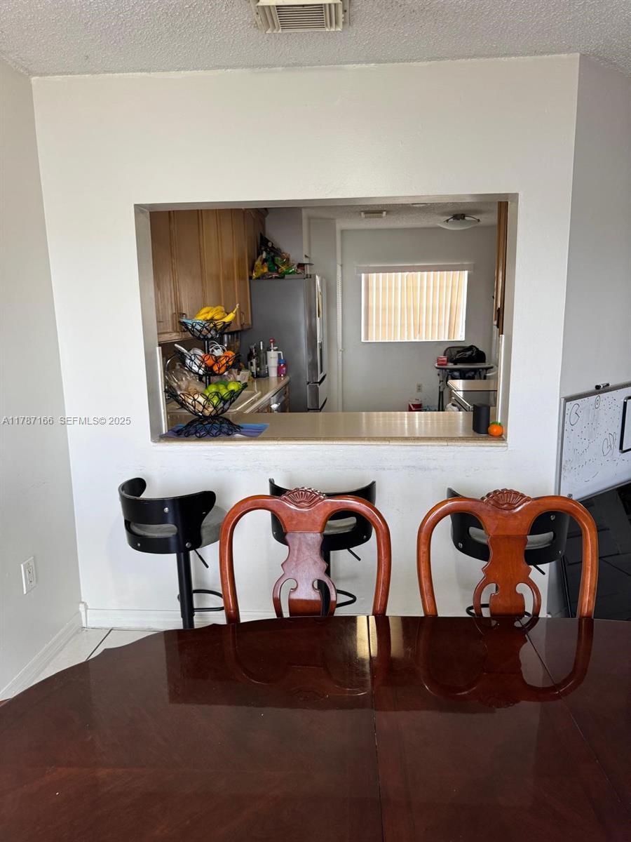 12355 Northwest 7th Lane Miami, FL 33182 - Photo 13 of 21 a front view of a livingroom with furniture and chandelier