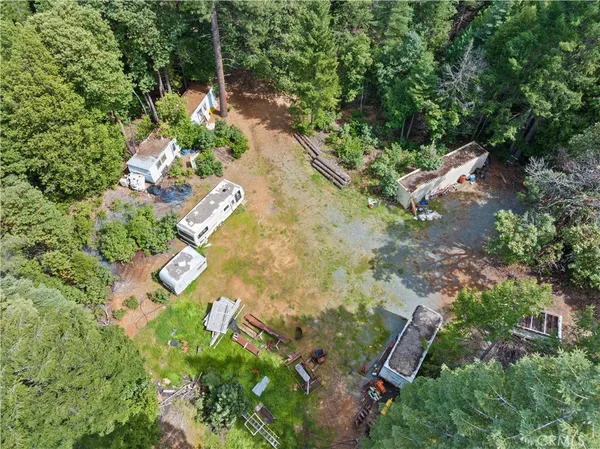 an aerial view of a house with a yard