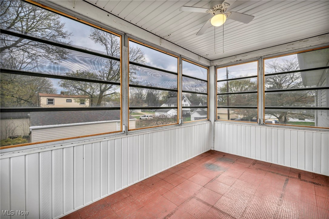 367 High Grove Boulevard Akron, OH 44312 - Photo 30 of 46 Unfurnished sunroom featuring a ceiling fan