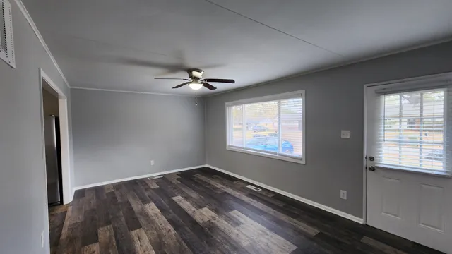 a view of an empty room with a window