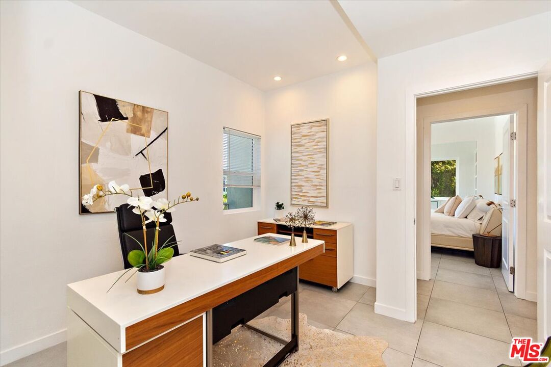 20 Ironsides Street, Unit 3 Marina del Rey, CA 90292 - Photo 18 of 32 a living room with furniture a chandelier and a dining table