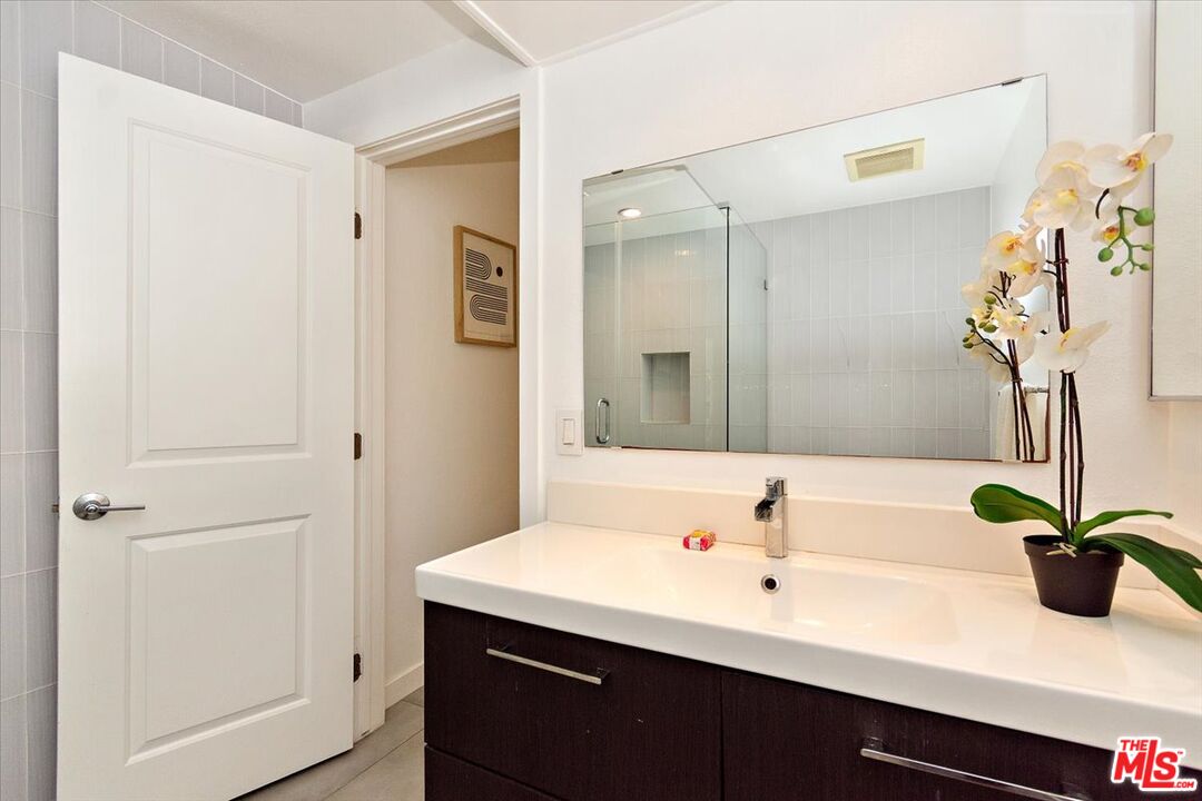 20 Ironsides Street, Unit 3 Marina del Rey, CA 90292 - Photo 22 of 32 a bathroom with a sink a light fixture and a mirror