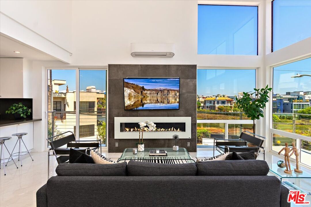 20 Ironsides Street, Unit 3 Marina del Rey, CA 90292 - Photo 6 of 32 a living room with furniture and a flat screen tv
