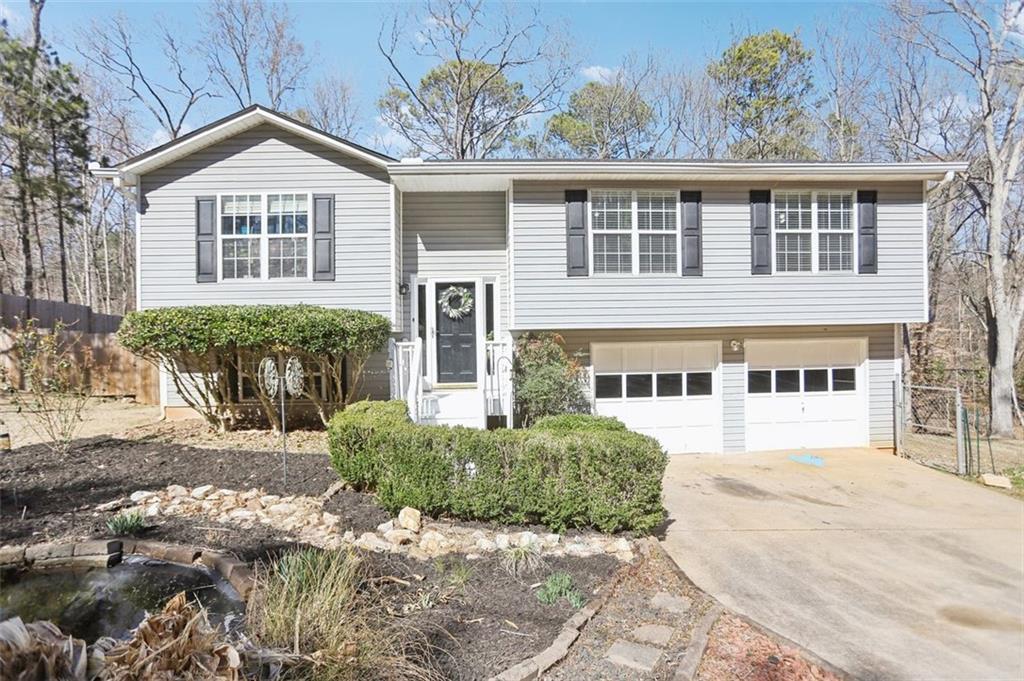 8740 Jenkins Road Winston, GA 30187 - Photo 1 of 1 a front view of a house with a yard
