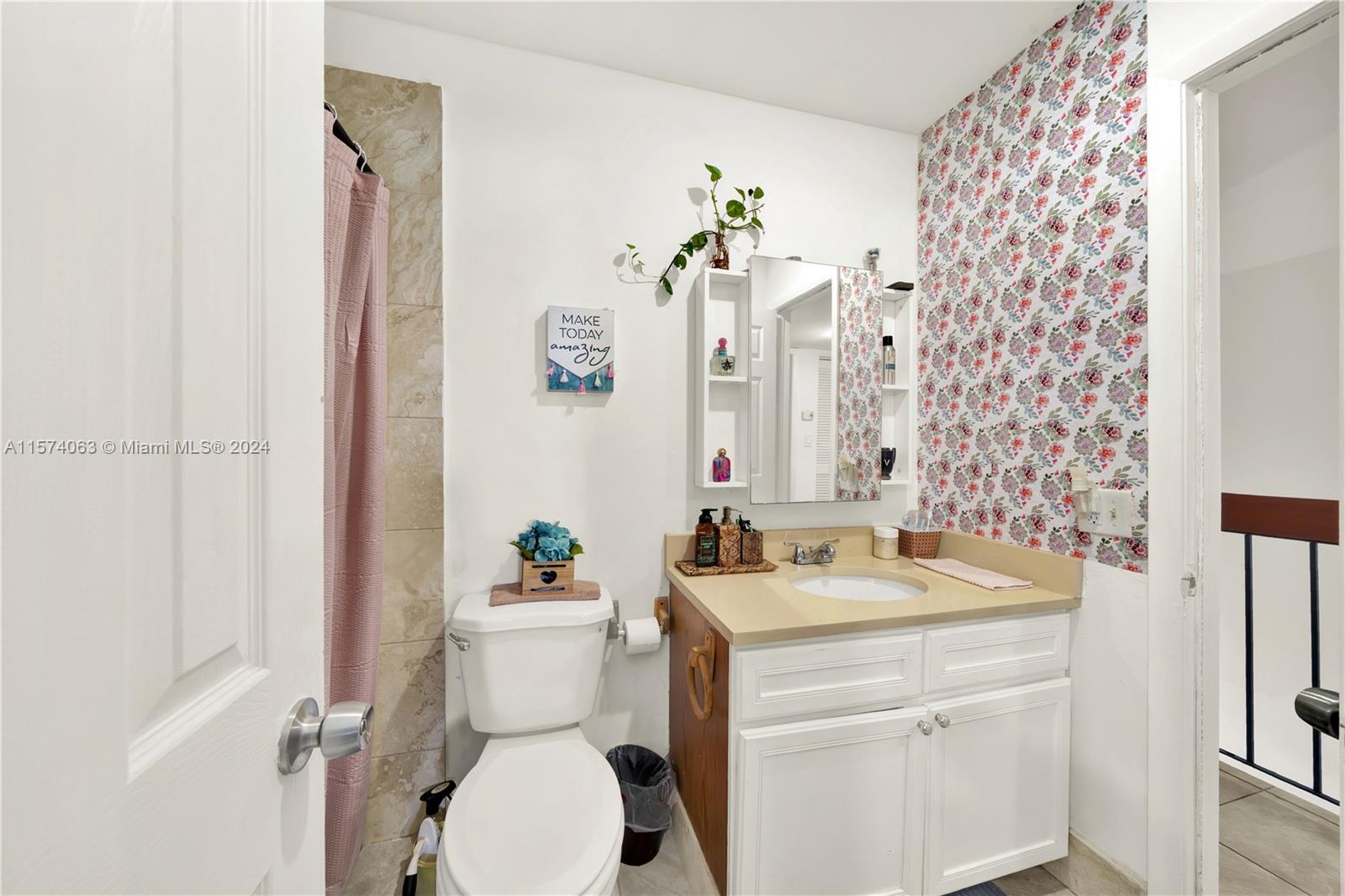 10810 Northwest 7th Street, Unit 6B Miami, FL 33172 - Photo 15 of 19 a bathroom with a sink toilet and shower