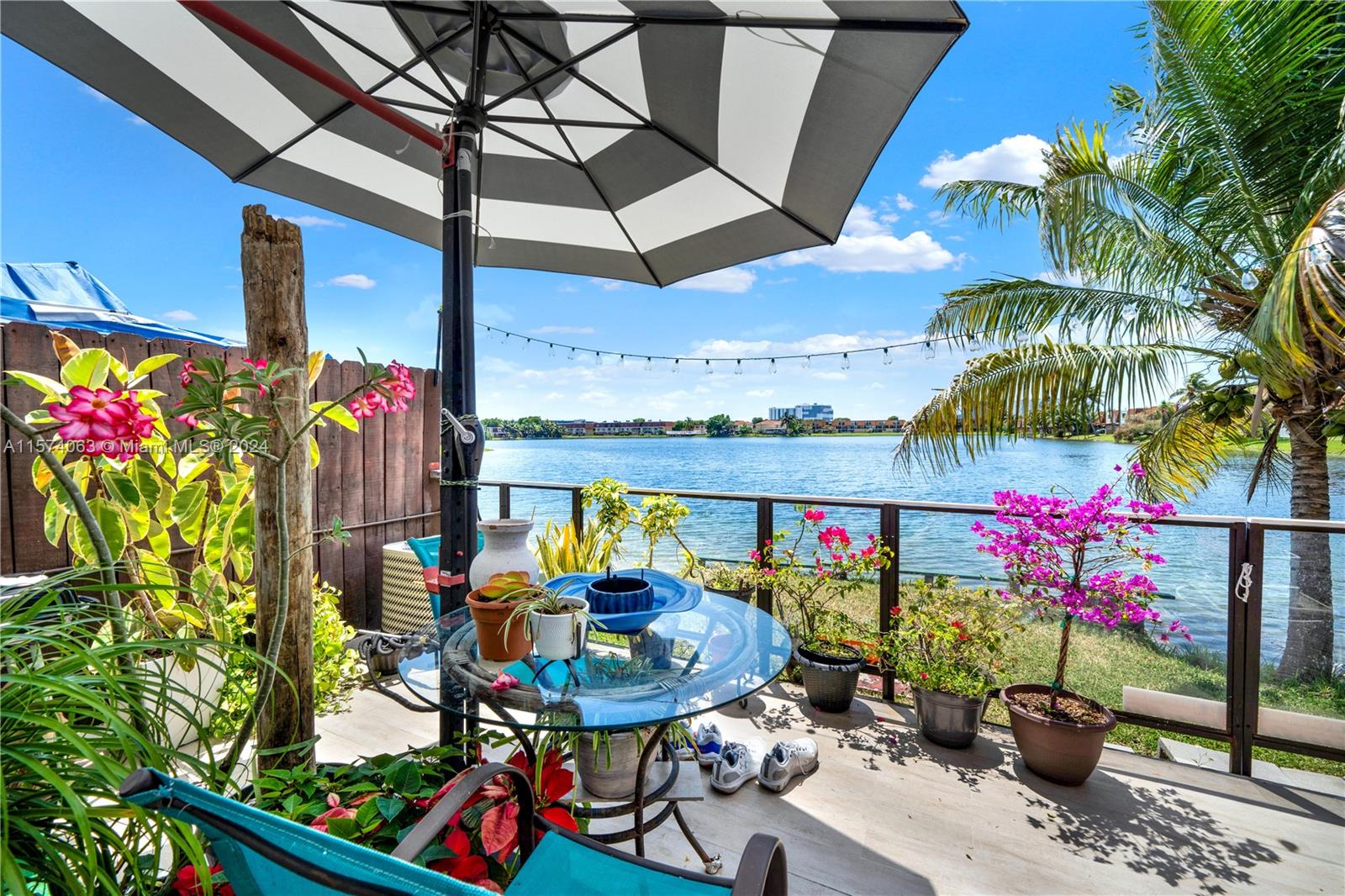 10810 Northwest 7th Street, Unit 6B Miami, FL 33172 - Photo 3 of 19 a view of a chairs and table in a patio