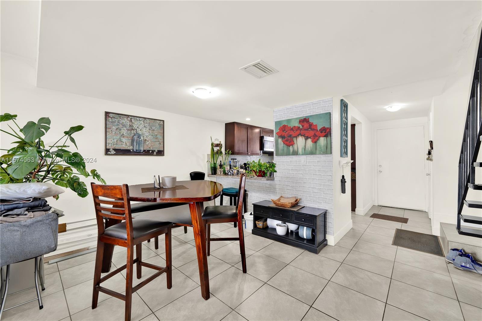 10810 Northwest 7th Street, Unit 6B Miami, FL 33172 - Photo 8 of 19 a living room with furniture and a flat screen tv