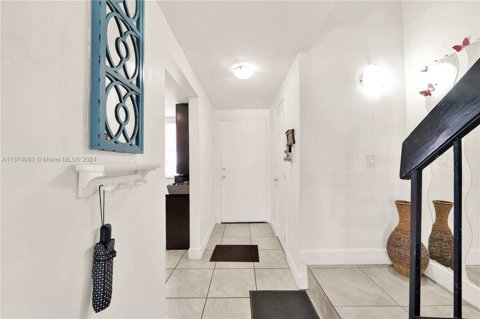 10810 Northwest 7th Street, Unit 6B Miami, FL 33172 - Photo 10 of 19 a view of entryway