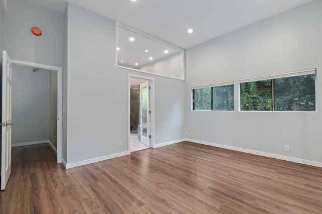 a bathroom with a sink mirror and shower