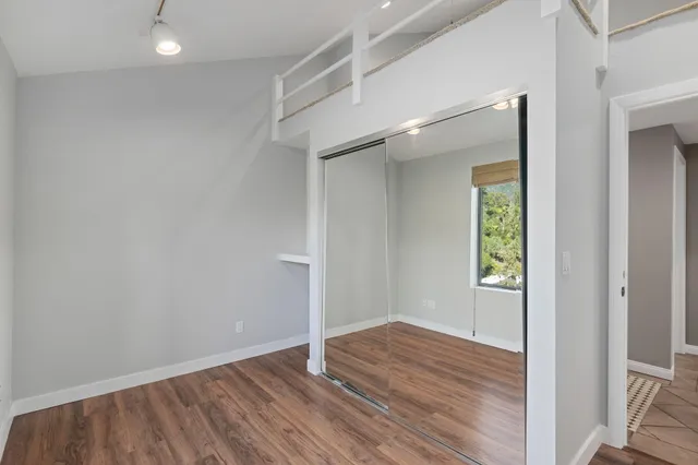 a bathroom with a sink a mirror and shower