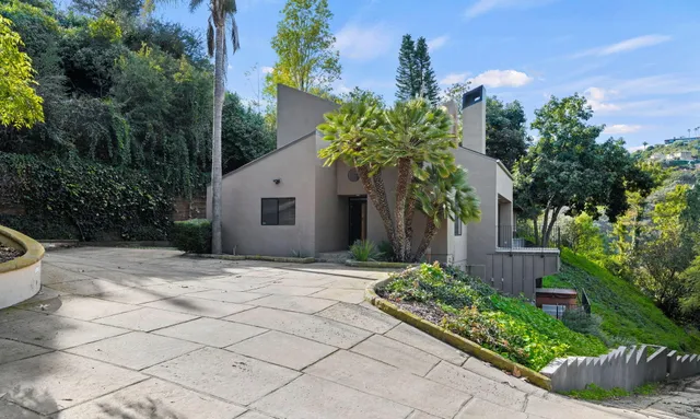 a view of a workspace with furniture and wooden floor