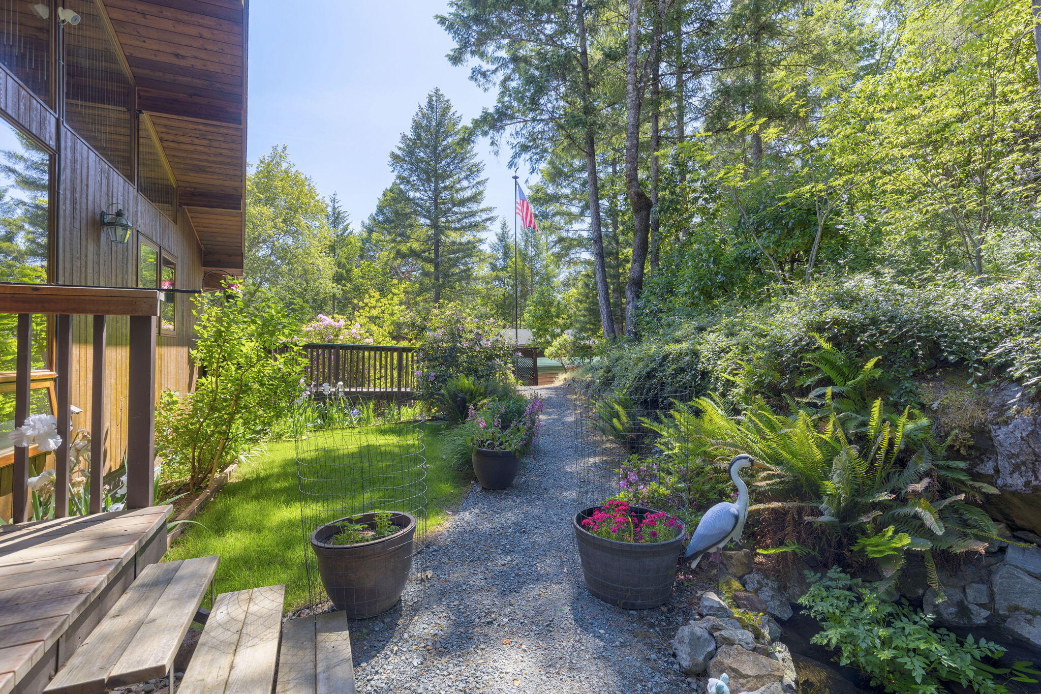 856 Greentree Loop Grants Pass, OR 97527 - Photo 8 of 62 a view of a garden with patio