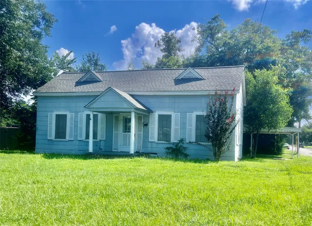 front view of a house with a yard