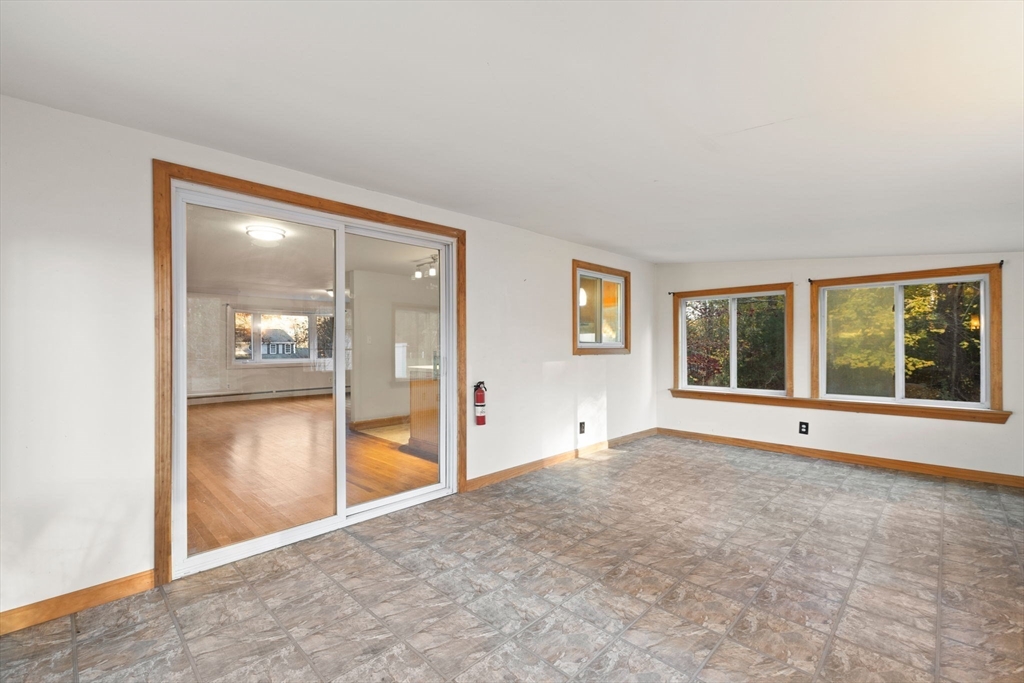 53 Forge Road Assonet, MA 02702 - Photo 18 of 39 an empty room with windows and entrance