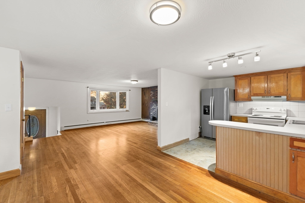 53 Forge Road Assonet, MA 02702 - Photo 8 of 39 a view of a kitchen with a sink cabinets and a living room