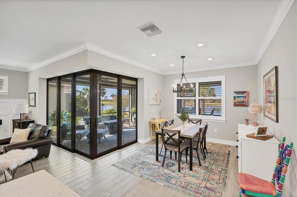 13057 Rinella Street Venice, FL 34293 - Photo 12 of 85 a view of a dining room with furniture window and outside view