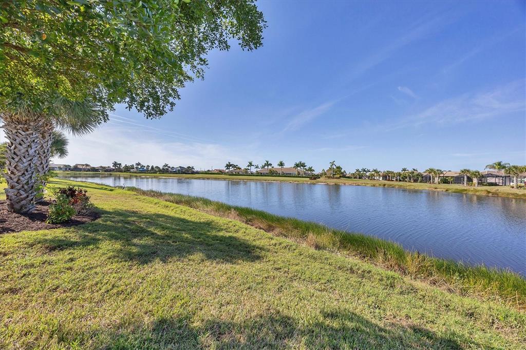 13057 Rinella Street Venice, FL 34293 - Photo 20 of 85 a view of a lake with houses in the back