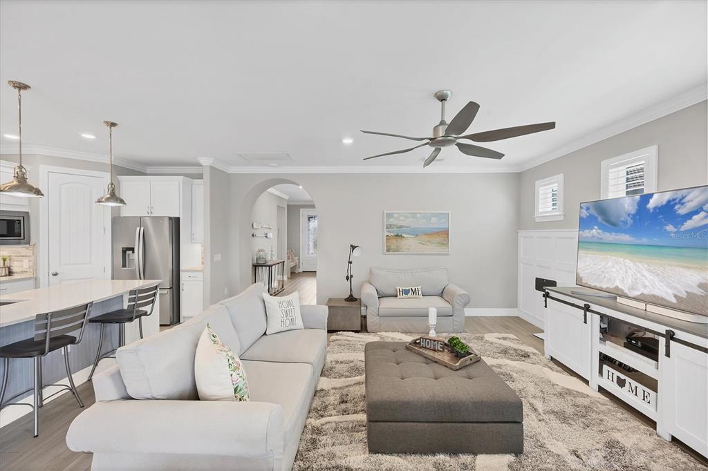 13057 Rinella Street Venice, FL 34293 - Photo 32 of 85 a living room with furniture and a wooden floor