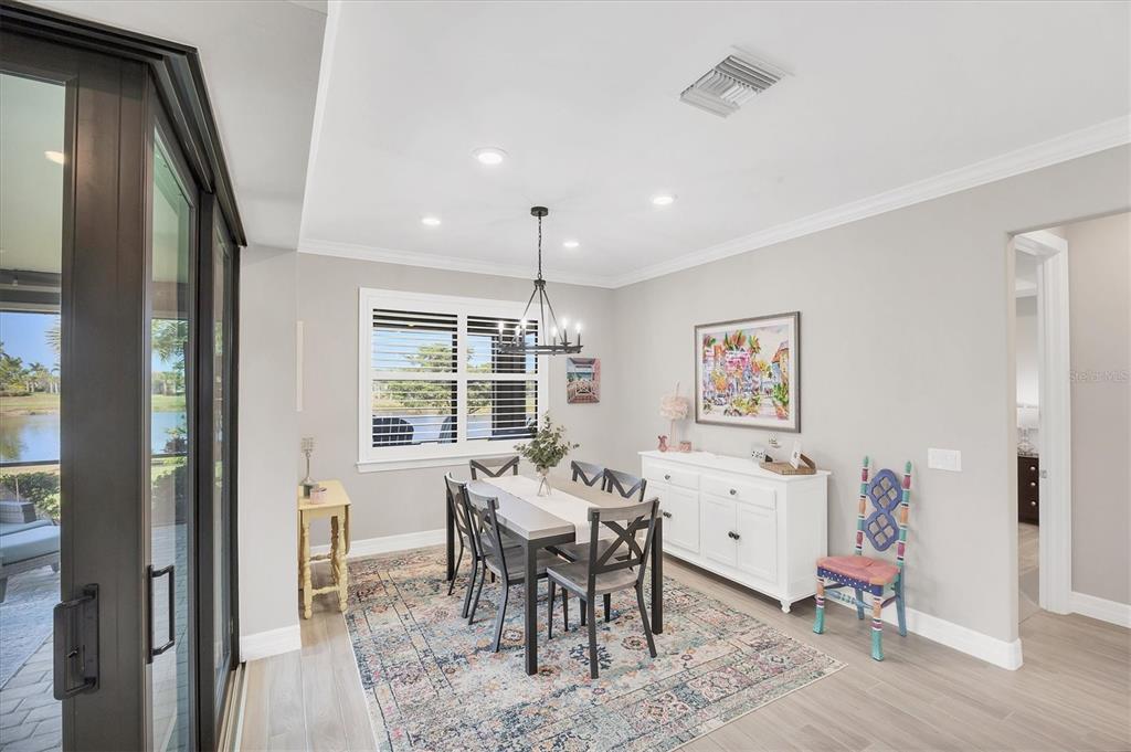 13057 Rinella Street Venice, FL 34293 - Photo 37 of 85 a dining room with furniture and window