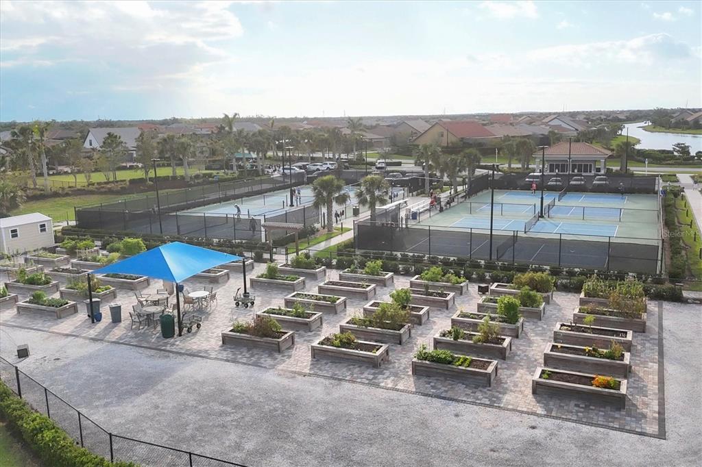 13057 Rinella Street Venice, FL 34293 - Photo 73 of 85 a view of a lake with a table and chairs