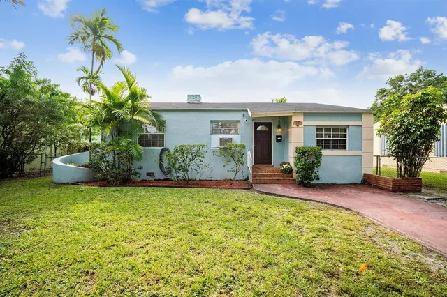 a house view with a garden space