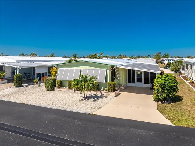an outdoor view of a house with a patio