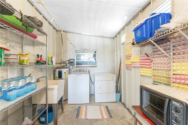 a kitchen with stainless steel appliances a stove a sink and a refrigerator
