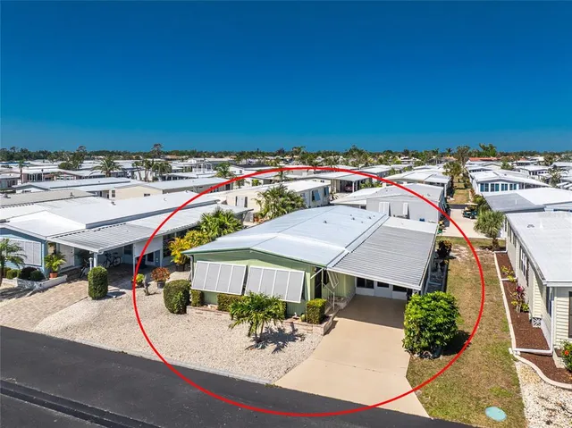 an aerial view of a house with a swimming pool