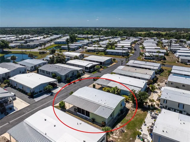 an aerial view of a houses with outdoor space