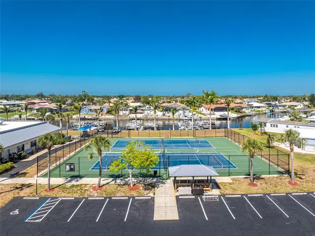 a view of a patio with a table and chairs