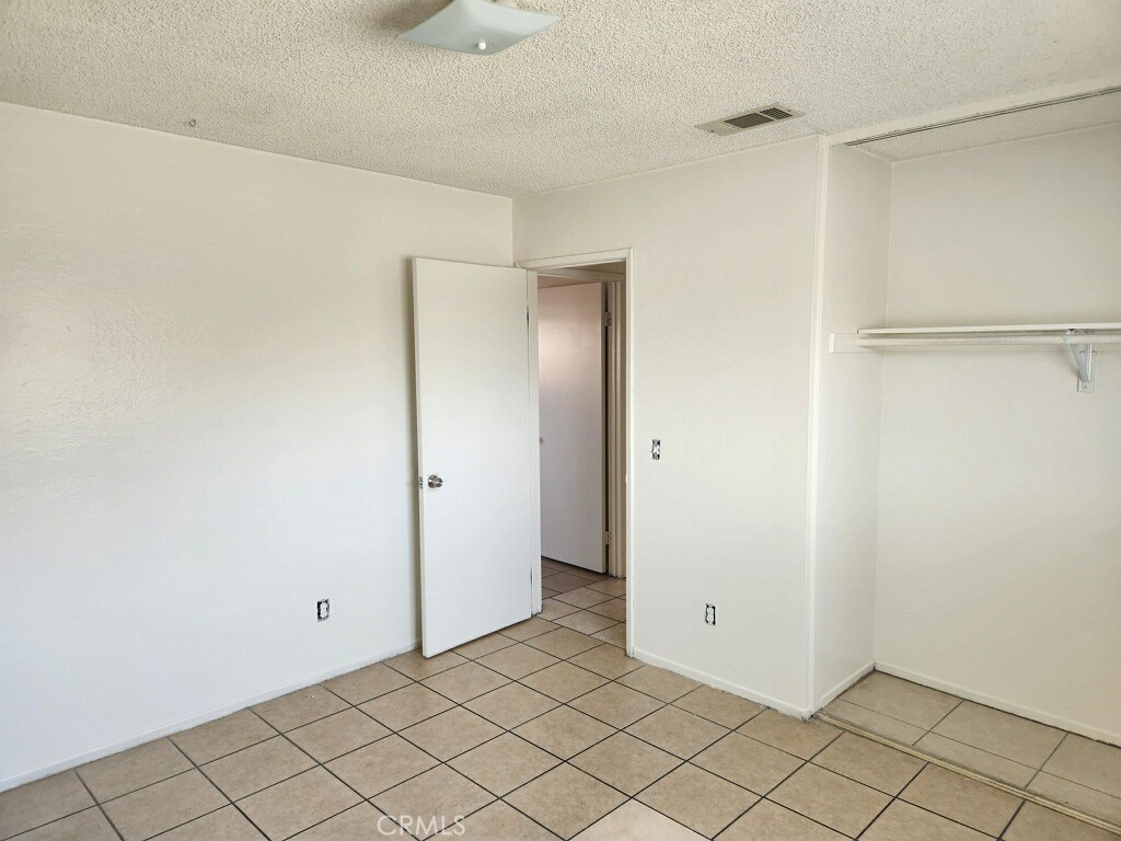 15418 Bear Valley Road, Unit 8 Victorville, CA 92395 - Photo 3 of 8 a view of an empty room