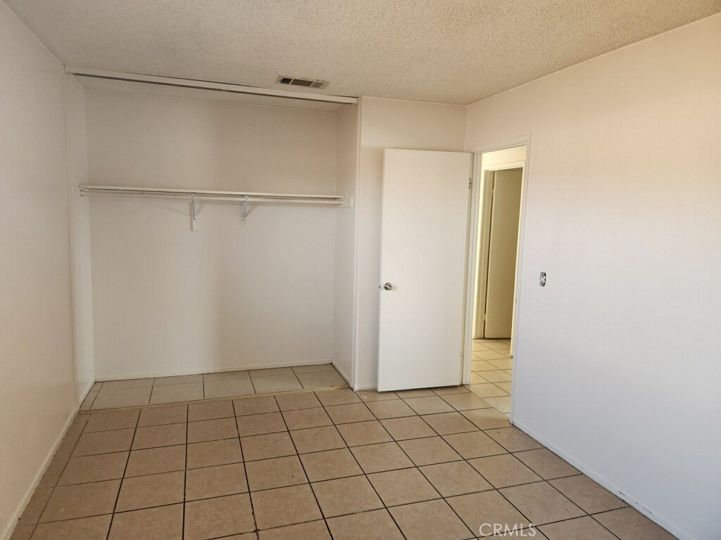 15418 Bear Valley Road, Unit 8 Victorville, CA 92395 - Photo 6 of 8 a view of an empty room